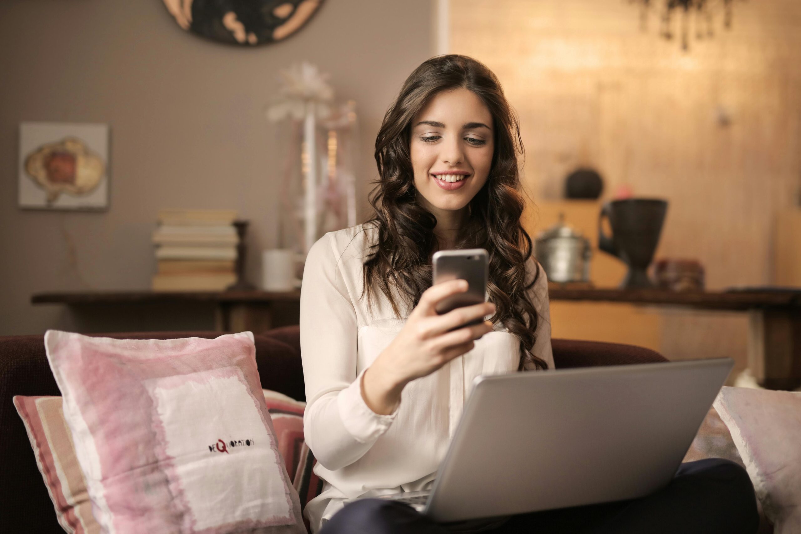 Woman looking at phone with credentials