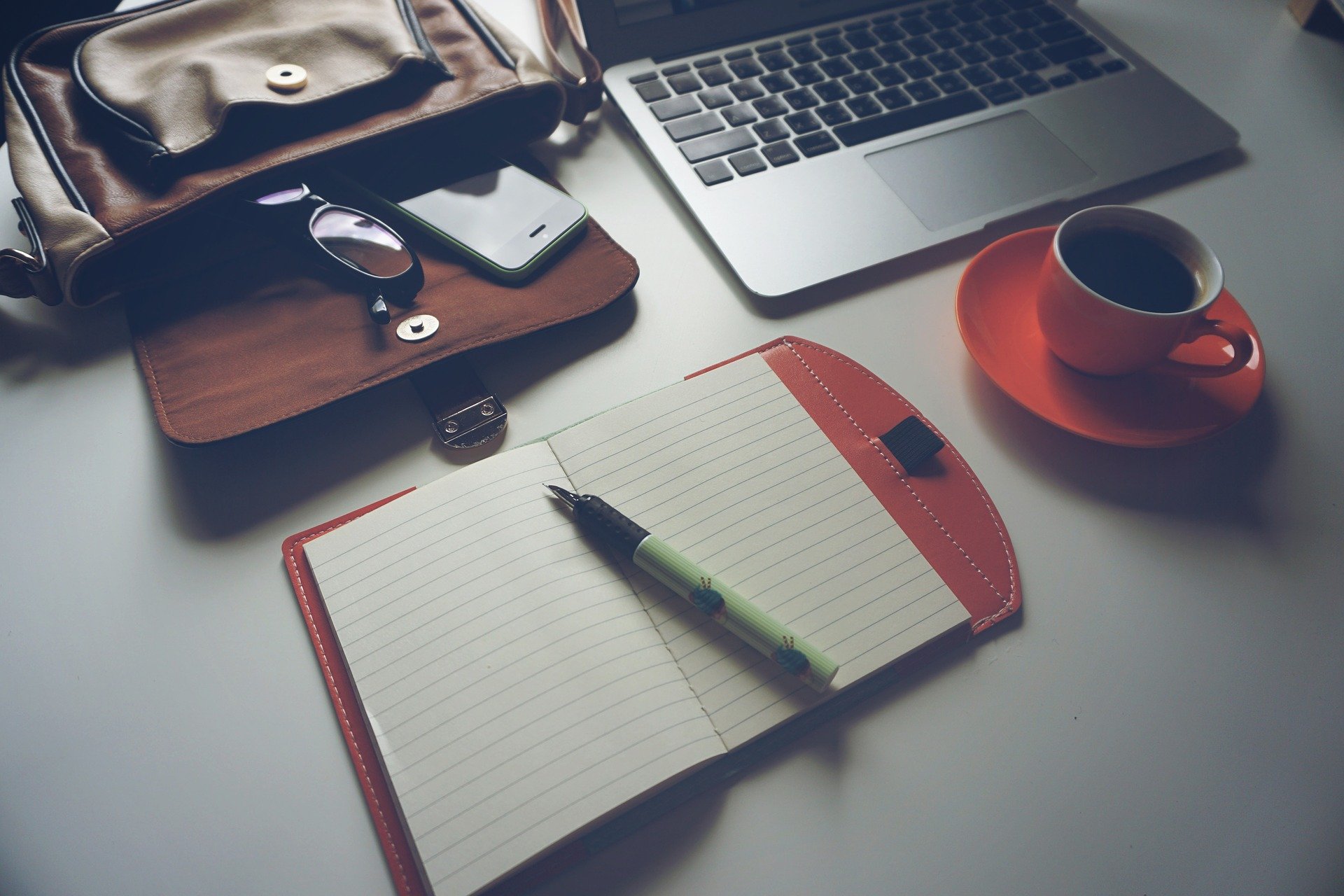 Laptop and pen on desk