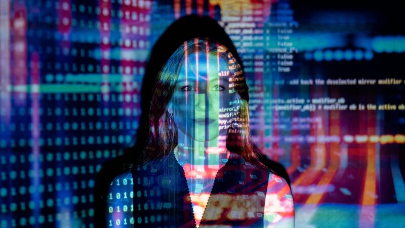 Code projected over woman