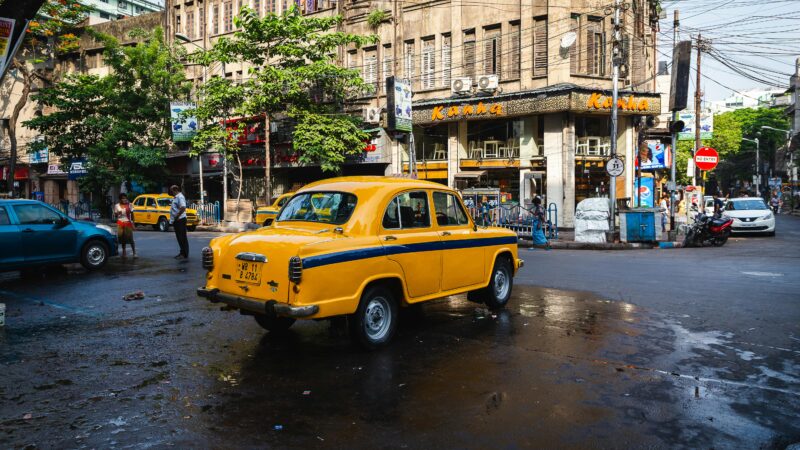 Taxi standing in front of a building