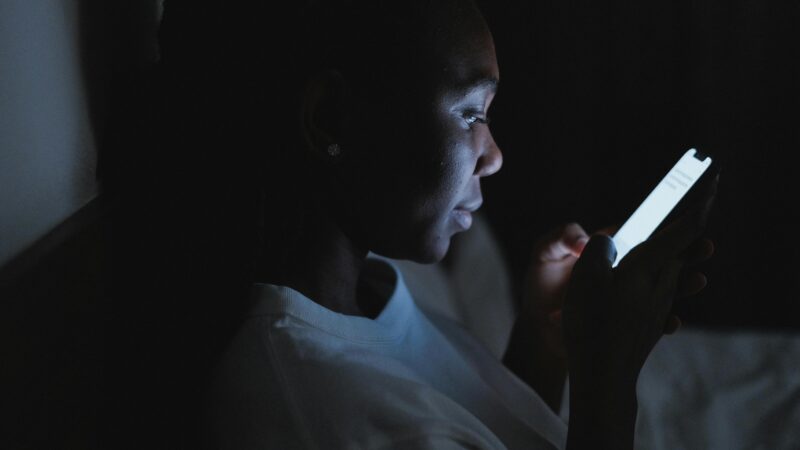 Child watching mobile phone